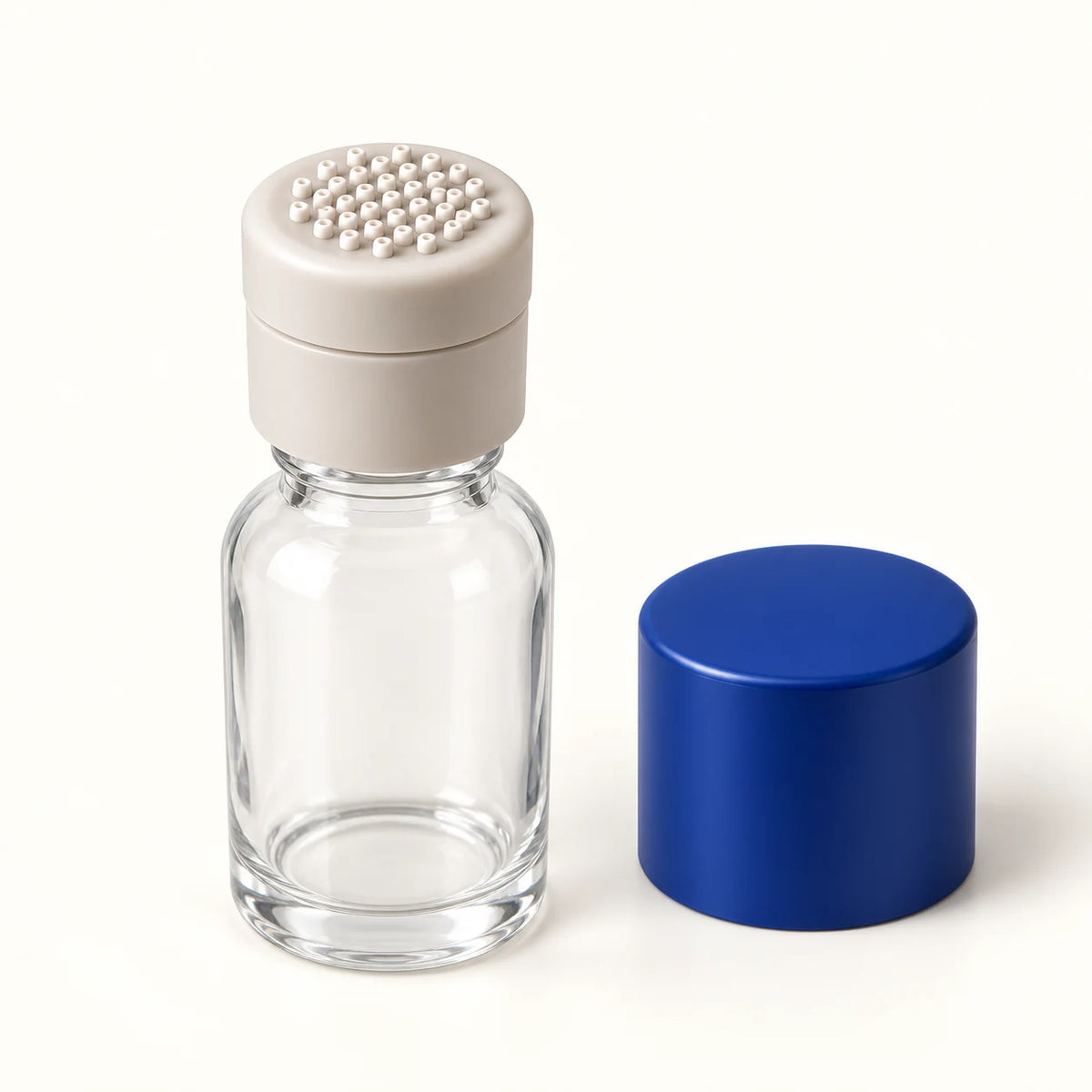 Product visualization showing the rounded application surface, bottle-mounted attachment, and separate protective cap of the APLD applicator.